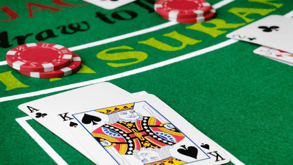 blackjack cards and chips on table