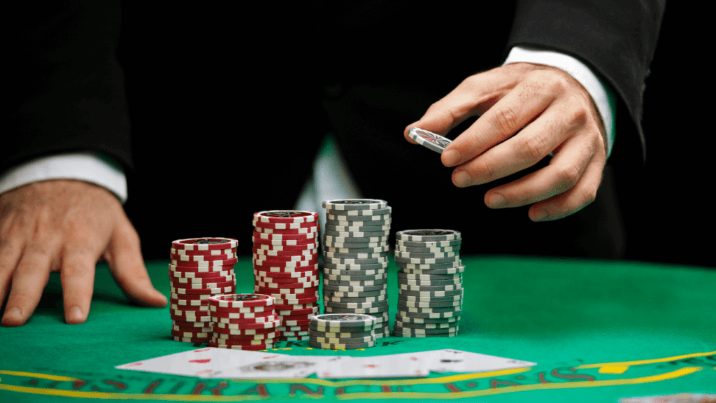 blackjack dealer, cards and chips on table