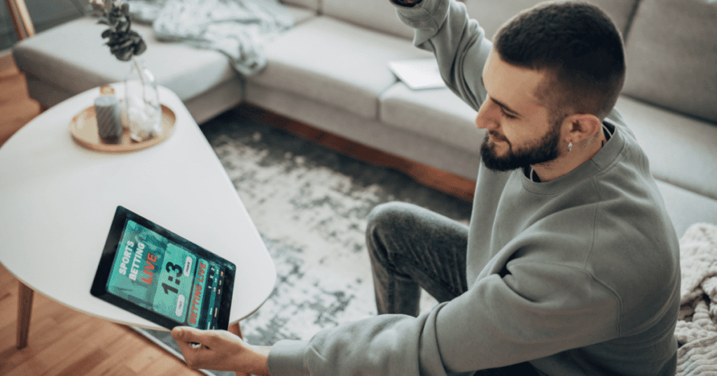 Άνδρας που υπολογίζει την γκανιότα στο online στοίχημα